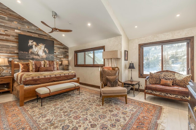 bedroom with multiple windows, recessed lighting, lofted ceiling, and wood finished floors