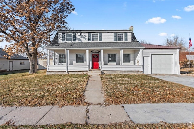 view of front of house featuring a porch, a garage, and a front lawn