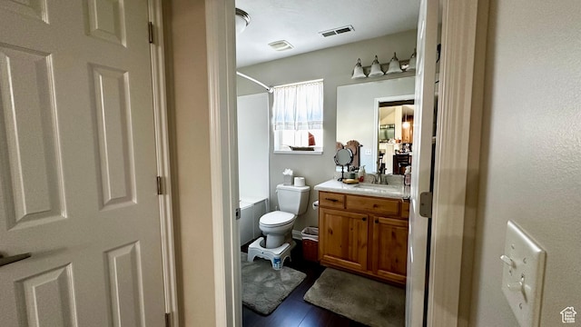 929 W 1920 S Unit A, Syracuse, UT 84075 - bathroom with hardwood / wood-style flooring, vanity, and toilet
