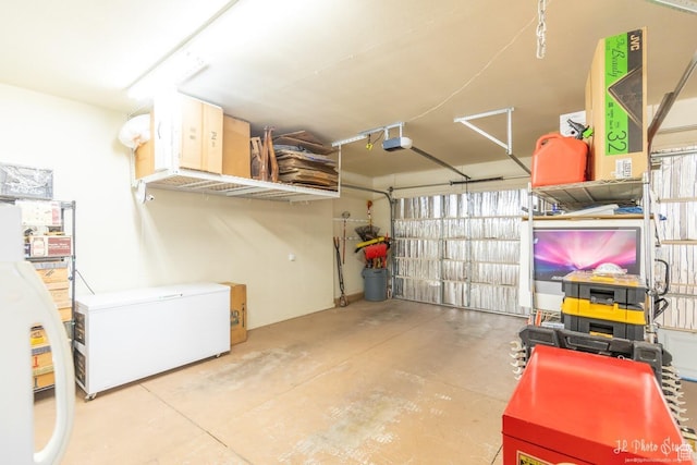 garage with fridge, a garage door opener, white refrigerator, and water heater
