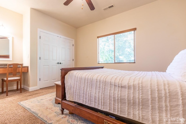 bedroom with carpet, ceiling fan, and a closet