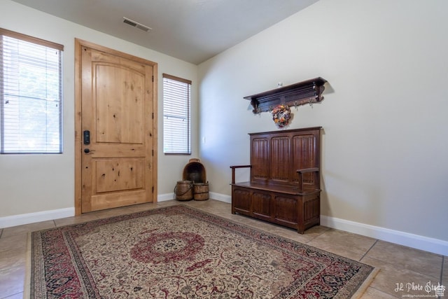 tiled entryway featuring a healthy amount of sunlight