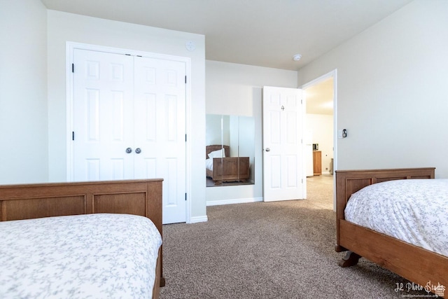 carpeted bedroom featuring a closet