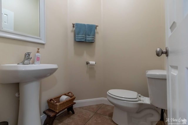 bathroom with tile patterned floors and toilet