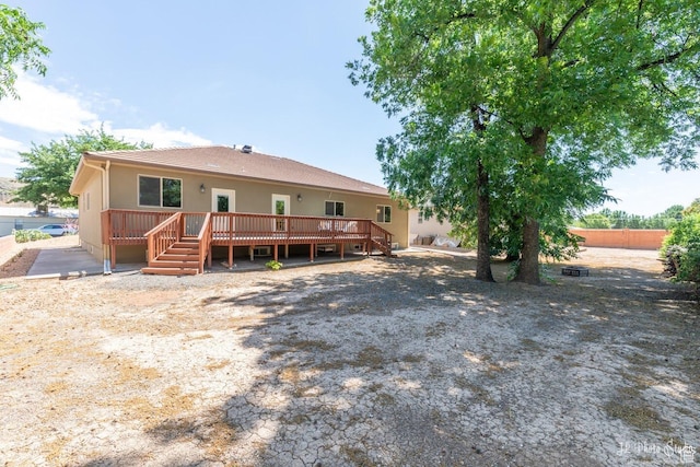 back of property with a deck