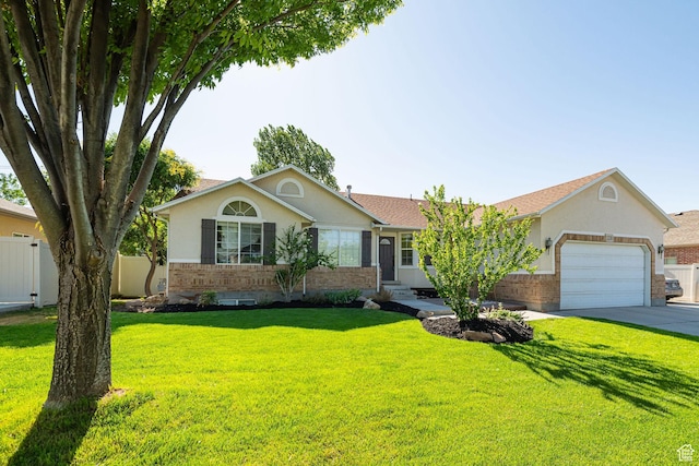 12138 S Willmar Cir, Riverton, UT 84065 - ranch-style home featuring stucco siding, an attached garage, concrete driveway, and brick siding