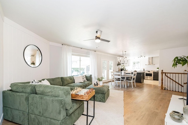 12138 S Willmar Cir, Riverton, UT 84065 - living area with ceiling fan, light wood-style flooring, and a chandelier
