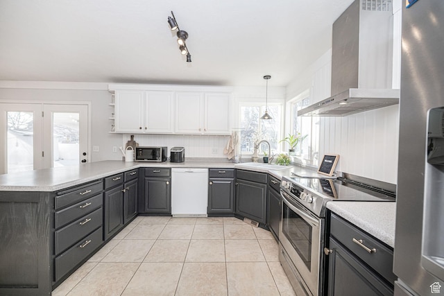 12138 S Willmar Cir, Riverton, UT 84065 - kitchen with appliances with stainless steel finishes, wall chimney exhaust hood, a peninsula, open shelves, and white cabinets
