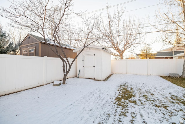 12138 S Willmar Cir, Riverton, UT 84065 - snowy yard with a shed and a fenced backyard