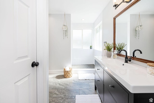 12138 S Willmar Cir, Riverton, UT 84065 - bathroom featuring marble tiled floors, vanity, and walk in shower