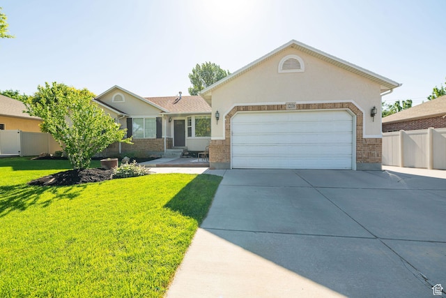 12138 S Willmar Cir, Riverton, UT 84065 - ranch-style home with concrete driveway, a garage, brick siding, and stucco siding