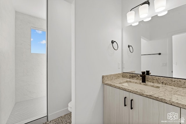 665 E 2015 N Unit 5C, Cedar City, UT 84721 - bathroom featuring vanity, toilet, and a tile shower