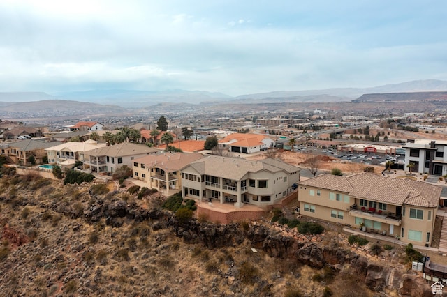 birds eye view of property featuring a mountain view