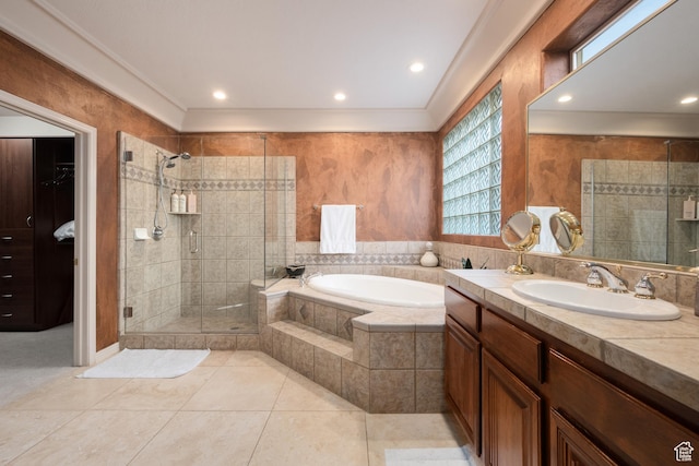 bathroom featuring tile patterned floors, vanity, and shower with separate bathtub