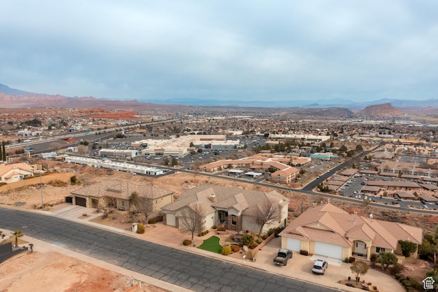 birds eye view of property with a mountain view