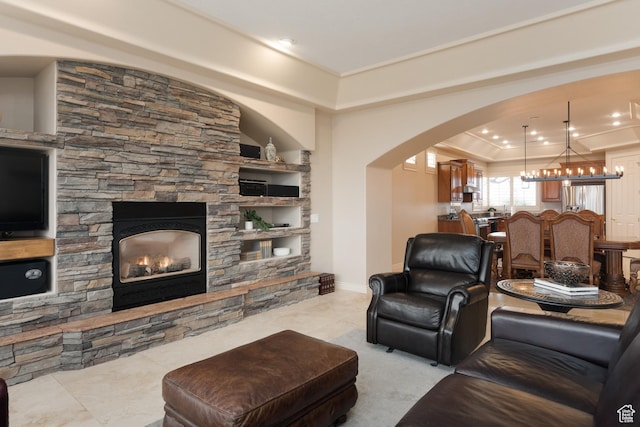 living room with a stone fireplace