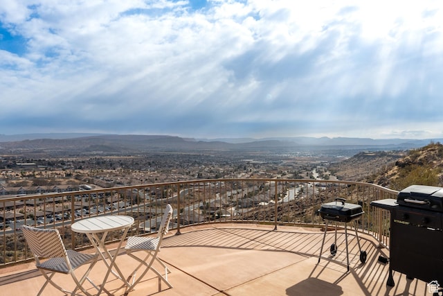 view of patio / terrace featuring a mountain view and a grill