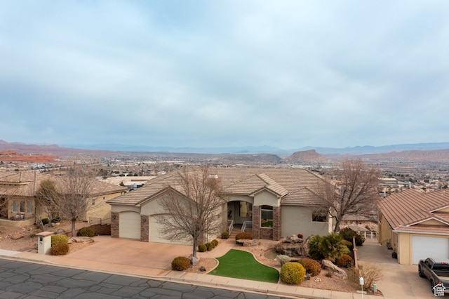 ranch-style house with a mountain view and a garage