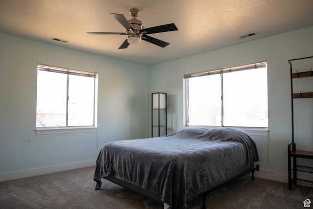 4188 S Oak Meadows Dr W Unit 21, Taylorsville, UT 84123 - bedroom with ceiling fan and dark colored carpet