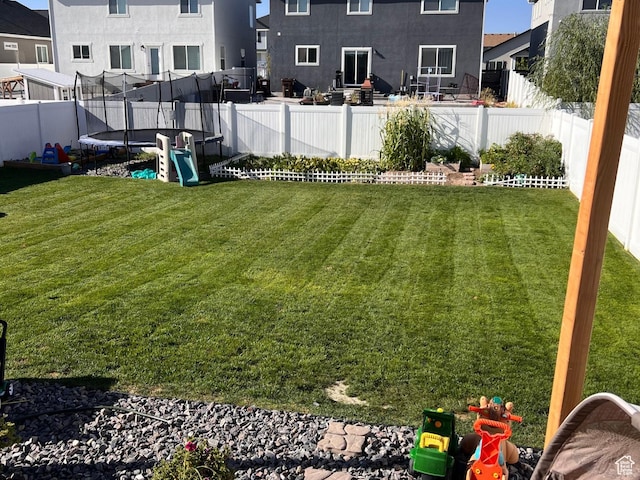 view of yard with a trampoline