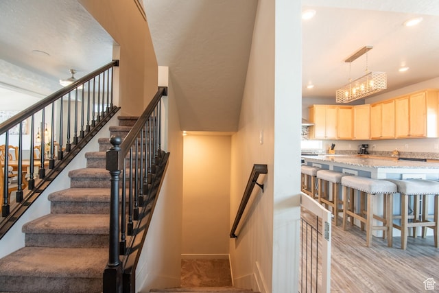324 S Hayes Well Ln, Saratoga Springs, UT 84045 - stairway with wood finished floors, baseboards, and recessed lighting