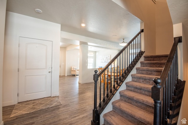 324 S Hayes Well Ln, Saratoga Springs, UT 84045 - stairway featuring baseboards and wood finished floors