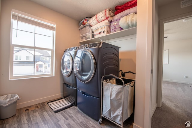 324 S Hayes Well Ln, Saratoga Springs, UT 84045 - clothes washing area with independent washer and dryer, visible vents, baseboards, wood finished floors, and laundry area