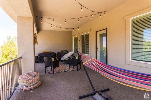 view of patio featuring a balcony