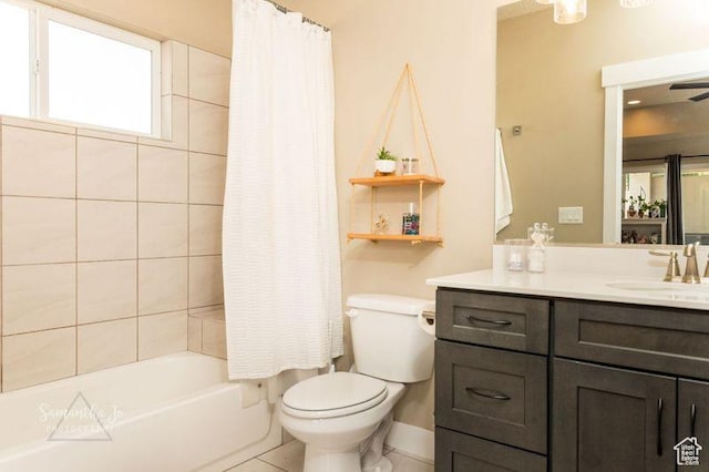 full bathroom with vanity, shower / tub combo with curtain, and toilet