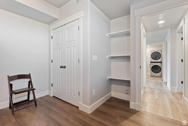 6007 W 8000 S, Payson, UT 84651 - hallway with stacked washer / drying machine, baseboards, and wood finished floors