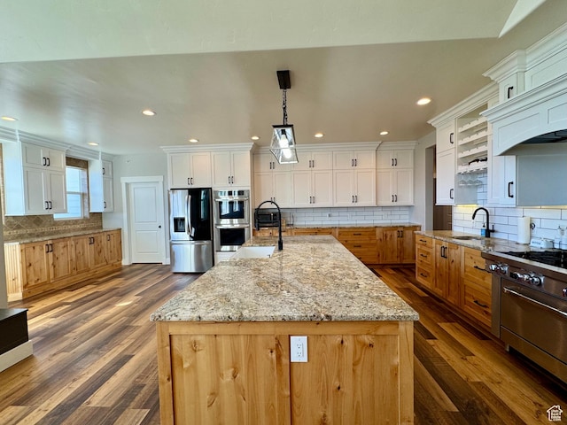 6007 W 8000 S, Payson, UT 84651 - kitchen with a large island, light stone counters, stainless steel appliances, white cabinetry, and pendant lighting
