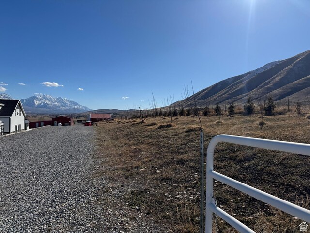 6007 W 8000 S, Payson, UT 84651 - view of road with driveway, a mountain view, and a rural view