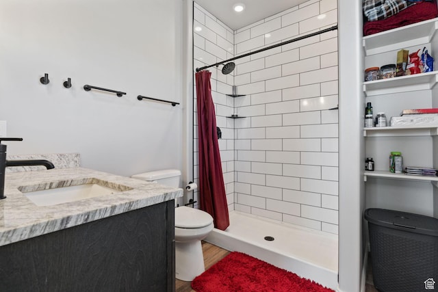 6007 W 8000 S, Payson, UT 84651 - bathroom featuring wood finished floors, a stall shower, vanity, and toilet