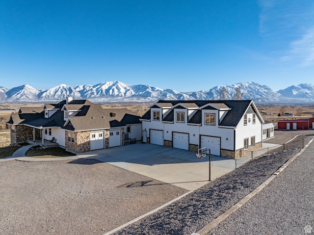 6007 W 8000 S, Payson, UT 84651 - modern inspired farmhouse featuring a residential view, stone siding, a mountain view, and driveway