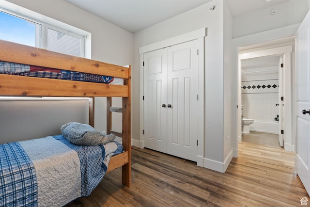 6007 W 8000 S, Payson, UT 84651 - bedroom featuring a closet, wood finished floors, and baseboards
