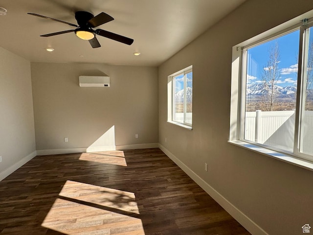 6007 W 8000 S, Payson, UT 84651 - empty room featuring baseboards, a mountain view, dark wood-type flooring, and a wall mounted air conditioner
