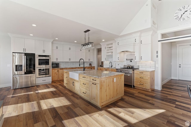 6007 W 8000 S, Payson, UT 84651 - kitchen featuring appliances with stainless steel finishes, a sink, a kitchen island with sink, and white cabinets