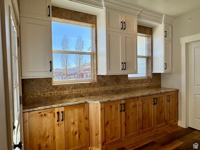 6007 W 8000 S, Payson, UT 84651 - kitchen featuring dark wood finished floors, white cabinetry, decorative backsplash, and light stone counters