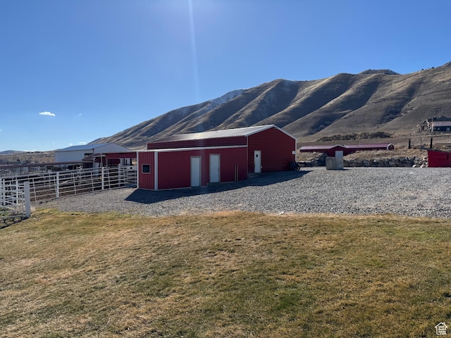 6007 W 8000 S, Payson, UT 84651 - view of pole building with a lawn, fence, and a mountain view