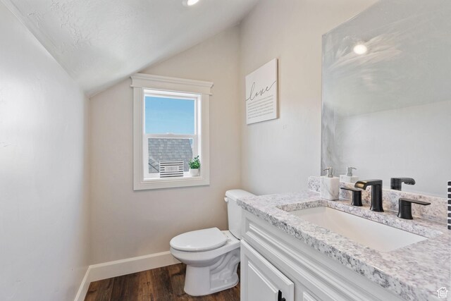6007 W 8000 S, Payson, UT 84651 - half bath with toilet, vaulted ceiling, vanity, wood finished floors, and baseboards