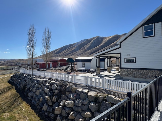 6007 W 8000 S, Payson, UT 84651 - rear view of house with a playground, a mountain view, and fence