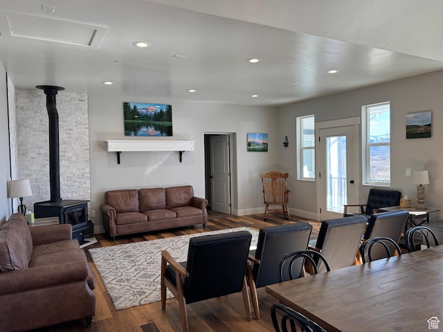 6007 W 8000 S, Payson, UT 84651 - living area featuring baseboards, wood finished floors, a wood stove, and recessed lighting