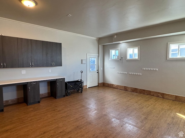 6007 W 8000 S, Payson, UT 84651 - kitchen with light countertops, crown molding, light wood-style flooring, and built in study area