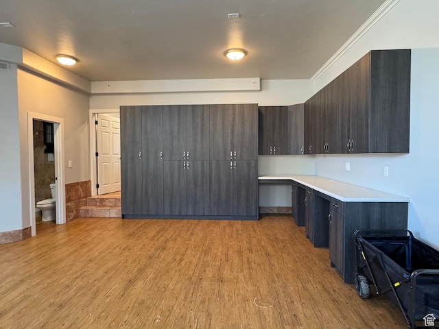 6007 W 8000 S, Payson, UT 84651 - kitchen with light countertops, light wood finished floors, modern cabinets, and dark brown cabinetry