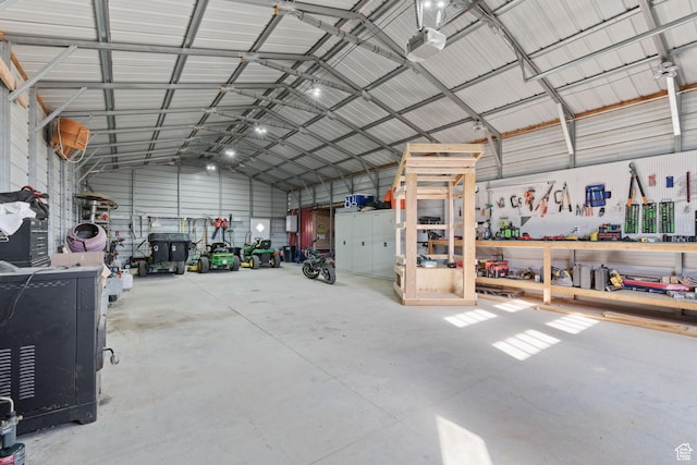 6007 W 8000 S, Payson, UT 84651 - garage with metal wall, a workshop area, and a garage door opener
