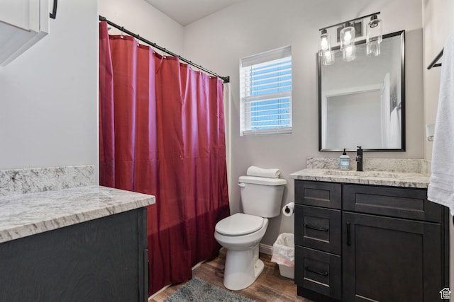 6007 W 8000 S, Payson, UT 84651 - bathroom with toilet, baseboards, wood finished floors, and vanity