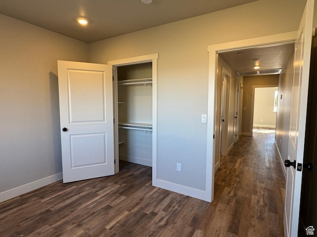 6007 W 8000 S, Payson, UT 84651 - unfurnished bedroom with a closet, visible vents, dark wood finished floors, and baseboards