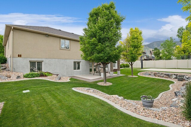 116 E Sandpiper Ln S, Saratoga Springs, UT 84045 - rear view of property featuring a patio, stucco siding, and a mountain view