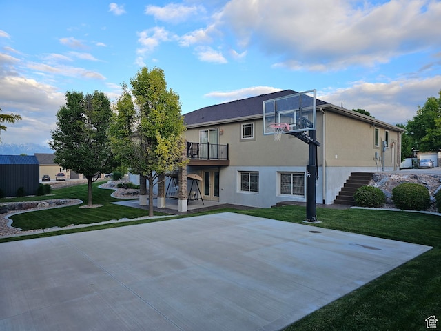 116 E Sandpiper Ln S, Saratoga Springs, UT 84045 - view of sport court featuring stairway, a lawn, and basketball hoop