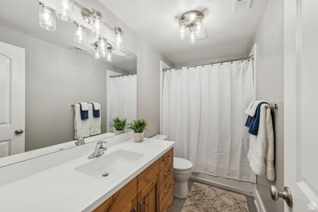 116 E Sandpiper Ln S, Saratoga Springs, UT 84045 - bathroom featuring vanity, toilet, and curtained shower